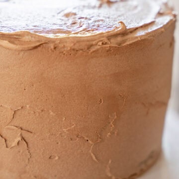 Smooth Chocolate Buttercream Frosting on a three layer cake